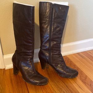 Side zip calf height boots.